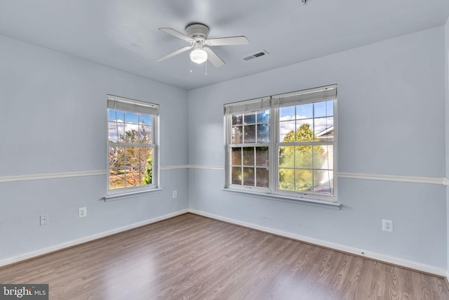 unfurnished room featuring wood-type flooring and ceiling fan