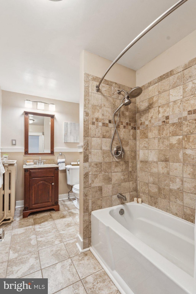 1411 W St, Annapolis, MD 21401 - full bath with toilet, vanity, tile patterned floors, tub / shower combination, and baseboards