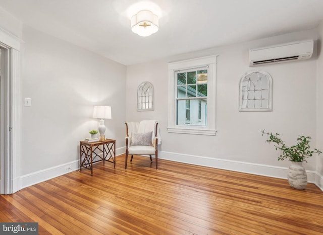 1411 W St, Annapolis, MD 21401 - living area featuring baseboards, light wood finished floors, and an AC wall unit
