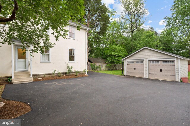 1411 W St, Annapolis, MD 21401 - exterior space with entry steps, an outbuilding, a garage, and fence