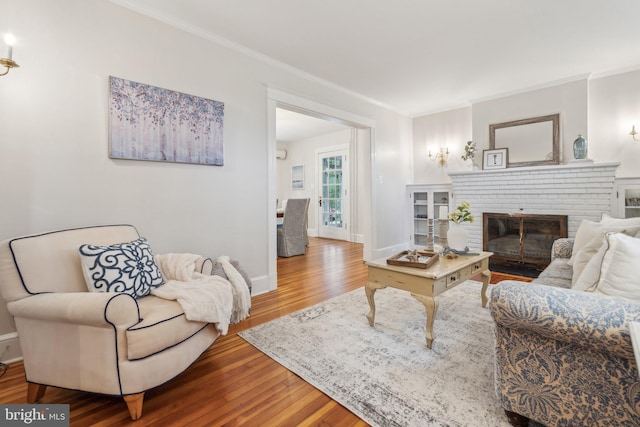 1411 W St, Annapolis, MD 21401 - living room with a fireplace, ornamental molding, baseboards, and wood finished floors