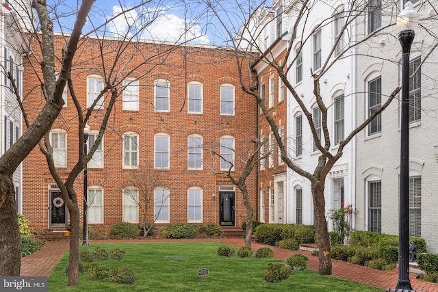 view of property featuring a front yard