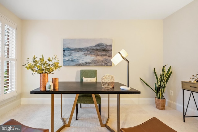 carpeted office space featuring plenty of natural light