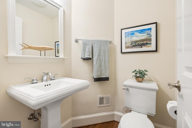 bathroom with sink and toilet