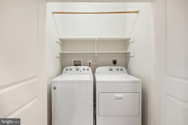 clothes washing area featuring washing machine and dryer