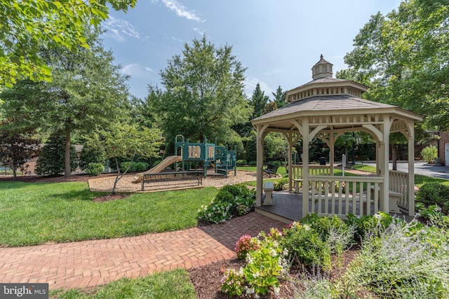 surrounding community featuring a playground, a gazebo, and a lawn