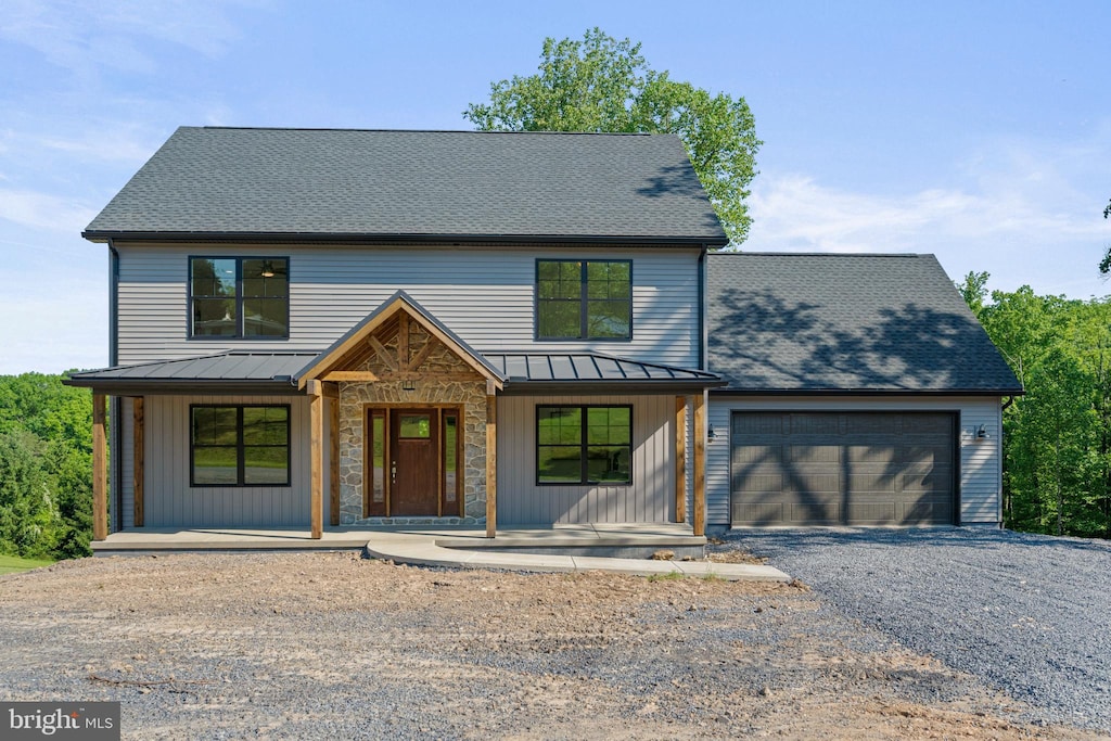 view of front of home featuring a garage and covered porch