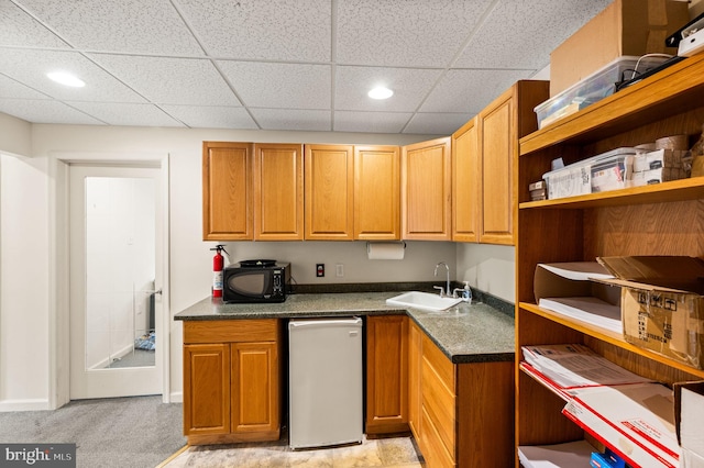 801 Yale Ave Unit H-G01, Swarthmore, PA 19081 - kitchen with a sink, open shelves, black microwave, dark countertops, and a paneled ceiling