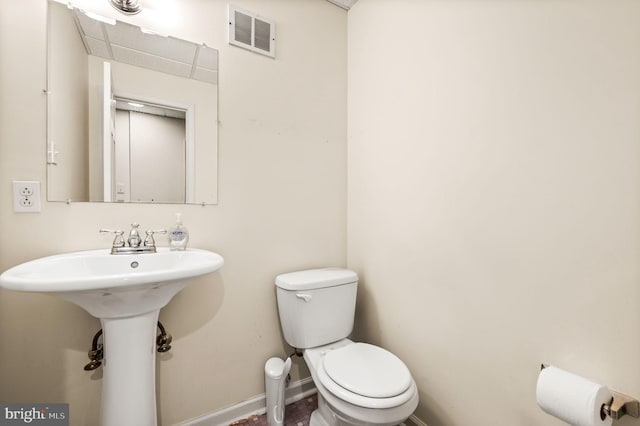 bathroom with sink and toilet