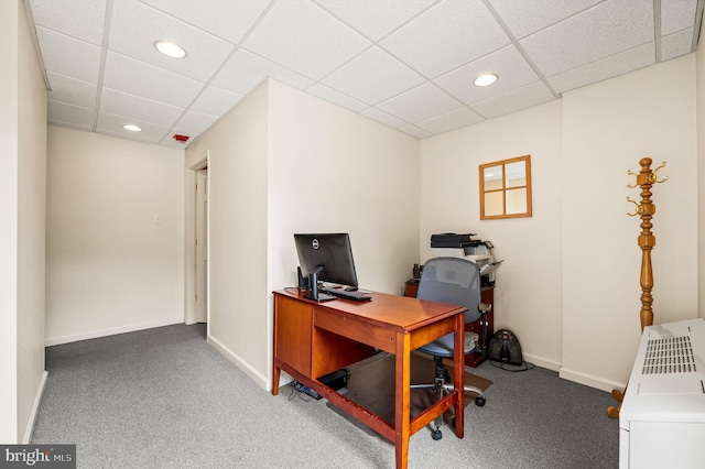 home office featuring a drop ceiling and carpet floors