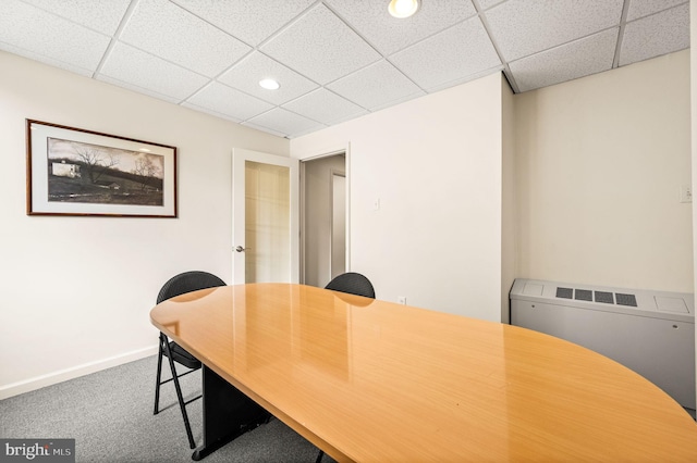 home office featuring a paneled ceiling, carpet, and radiator