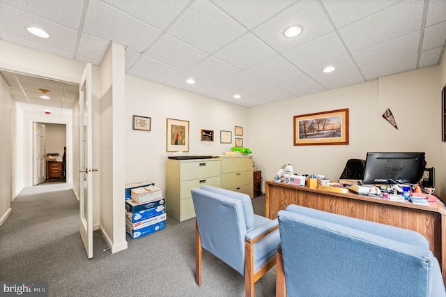 office area featuring carpet and a drop ceiling