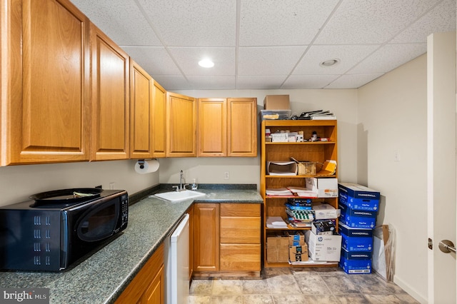 801 Yale Ave Unit H-G01, Swarthmore, PA 19081 - kitchen featuring a sink, black microwave, a paneled ceiling, white dishwasher, and recessed lighting