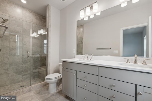 bathroom with vanity, toilet, and walk in shower