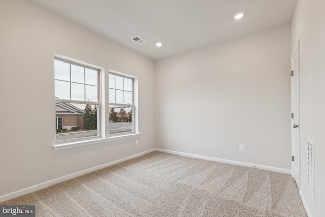 unfurnished room with carpet flooring