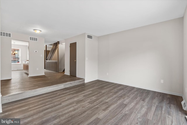 spare room with hardwood / wood-style floors