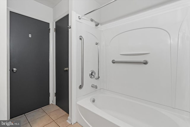 bathroom with tile patterned flooring and bathtub / shower combination