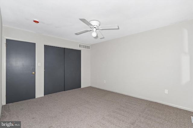 unfurnished bedroom with ceiling fan and carpet floors