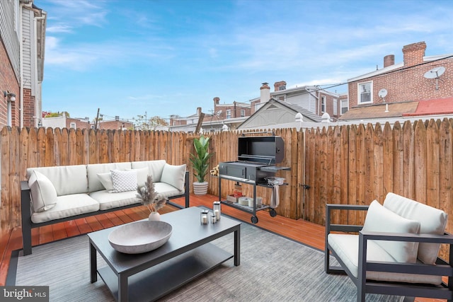 exterior space featuring outdoor lounge area and a wooden deck