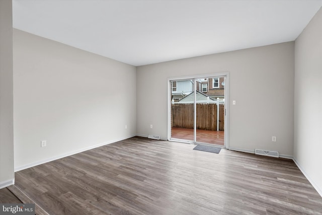 empty room featuring wood-type flooring