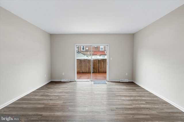 empty room featuring hardwood / wood-style floors