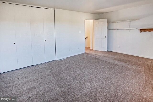 unfurnished bedroom with carpet flooring