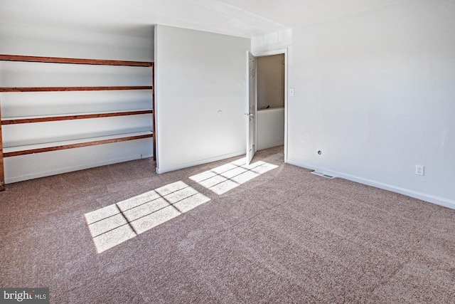 unfurnished bedroom with light colored carpet