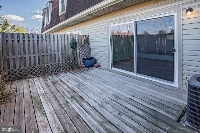 wooden terrace featuring central AC unit