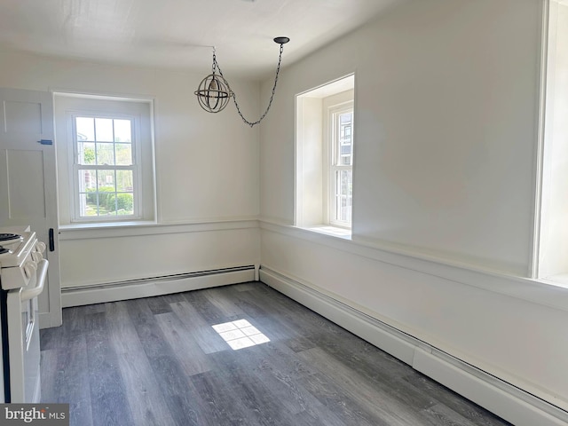 unfurnished dining area with hardwood / wood-style flooring, baseboard heating, and a chandelier