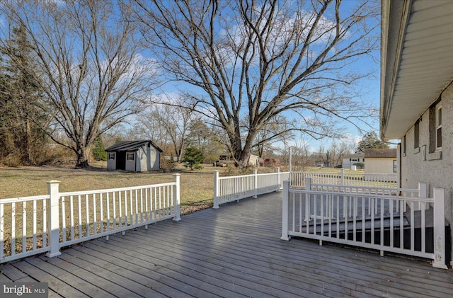 deck featuring a lawn and a storage shed