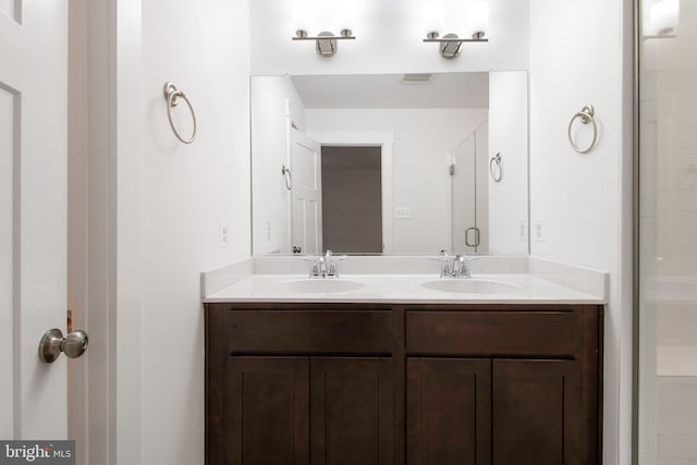 bathroom with vanity and an enclosed shower