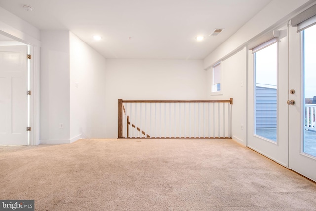 carpeted empty room with french doors