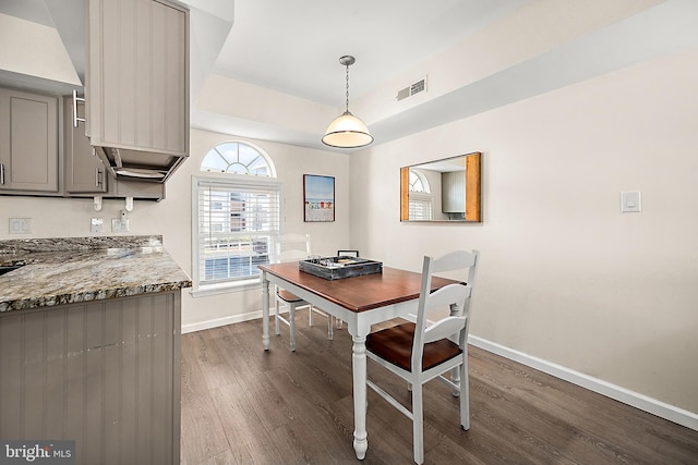 dining space featuring dark hardwood / wood-style floors