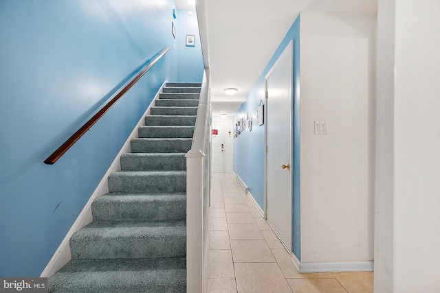 staircase with tile patterned flooring