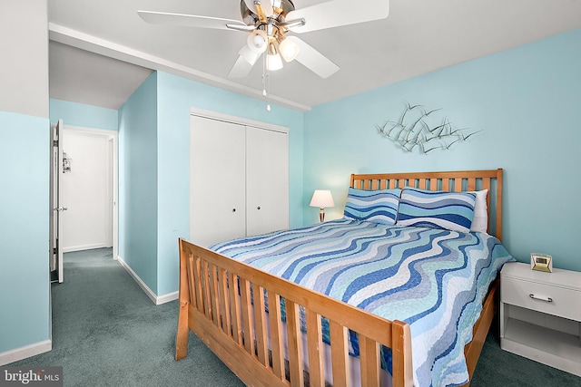 carpeted bedroom featuring ceiling fan and a closet