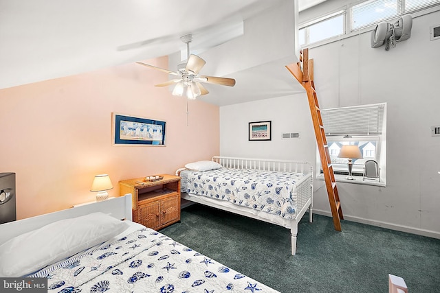 bedroom featuring dark colored carpet, vaulted ceiling, and ceiling fan