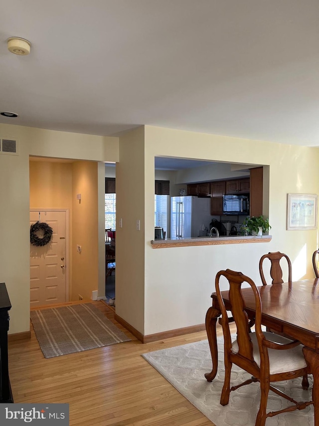 dining area featuring light hardwood / wood-style floors