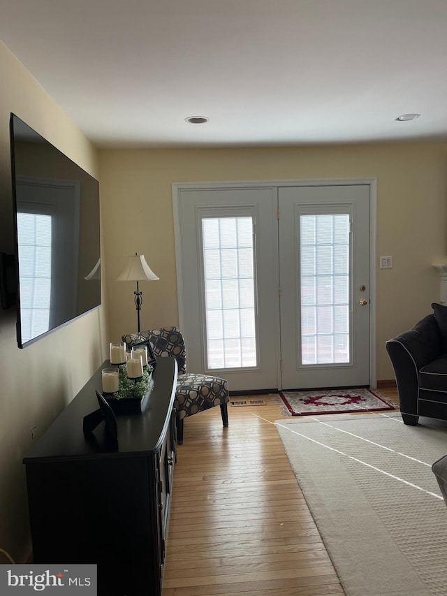 doorway with wood-type flooring