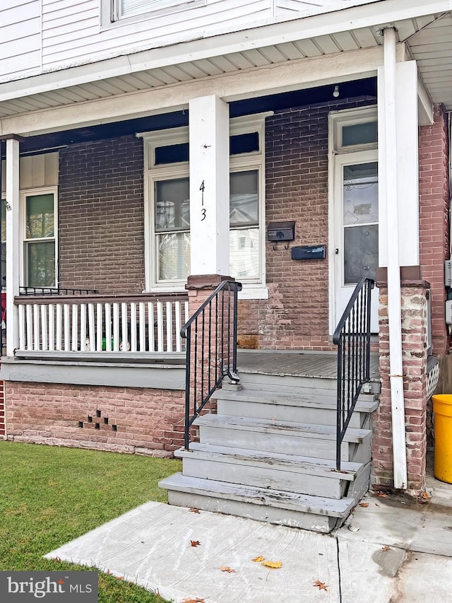 entrance to property with covered porch