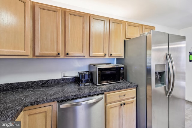 kitchen featuring light brown cabinets and appliances with stainless steel finishes