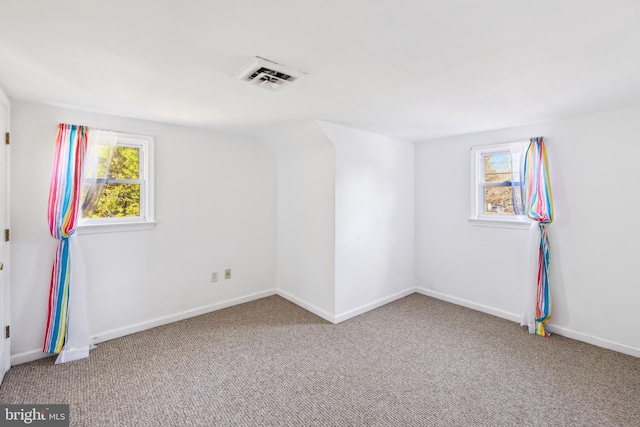 empty room with carpet flooring