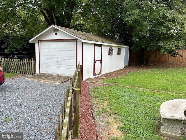 garage with a yard