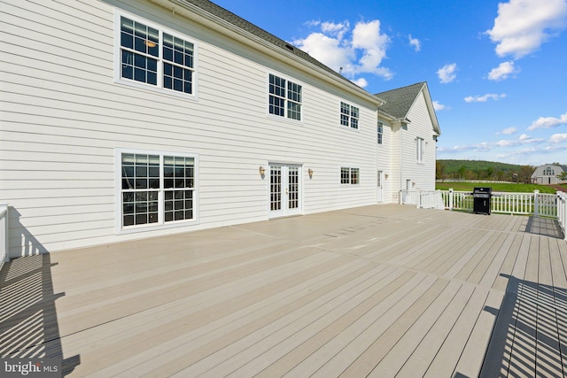 wooden terrace featuring a grill