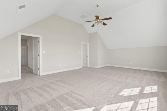 bonus room featuring visible vents, light carpet, baseboards, ceiling fan, and vaulted ceiling