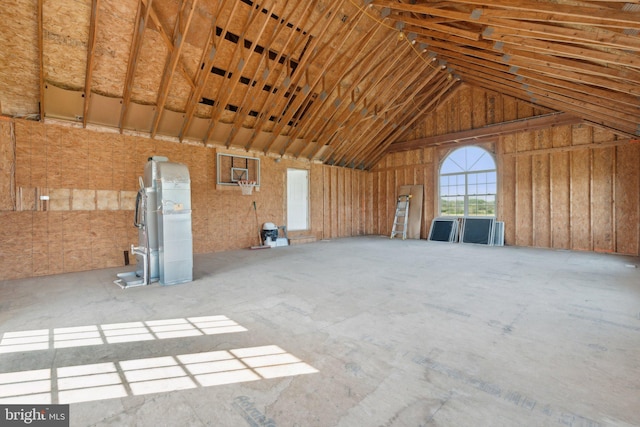 miscellaneous room with lofted ceiling and a garage