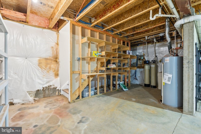 unfinished basement with electric water heater