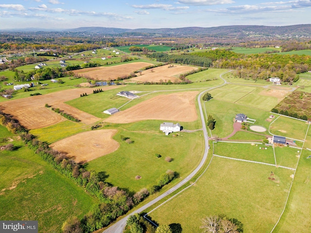 bird's eye view featuring a rural view and a mountain view