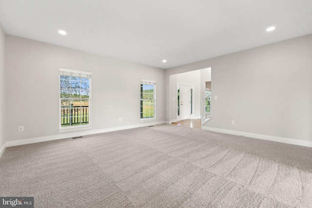 unfurnished room featuring baseboards, carpet flooring, and recessed lighting