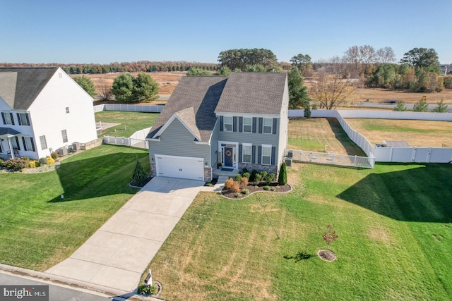 view of front of house featuring a garage and a front yard