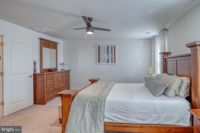 bedroom featuring light carpet and ceiling fan